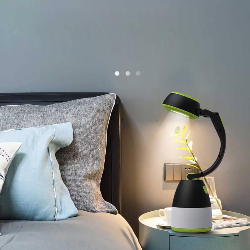 3-in-1 LED table lamp, tent light and foldable flashlight on a bedside table.