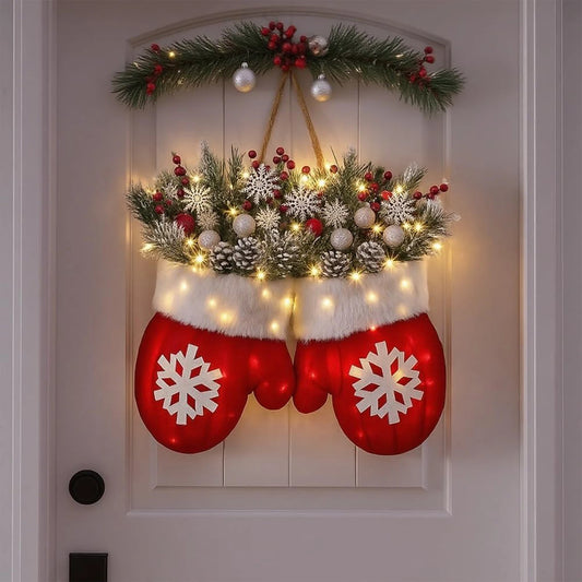 Glove-shaped red mitten wreath with white snowflakes, fur trim, pine cones, berries and warm lights for door decor.