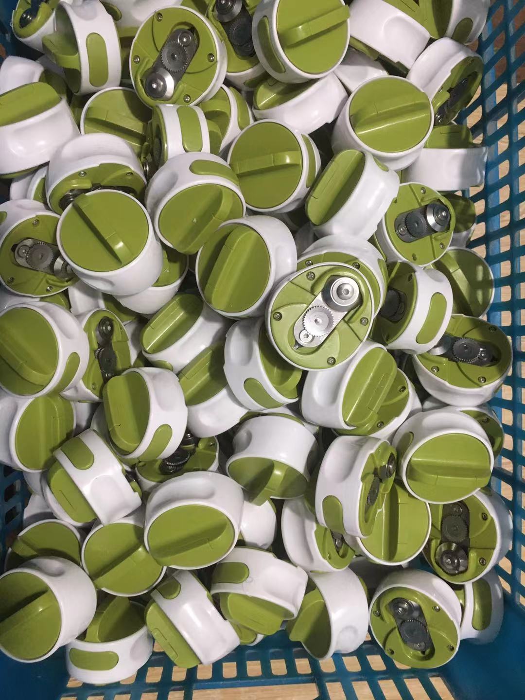 Stainless steel bottle opener kitchen gadget, labor-saving design, bulk green and white units.